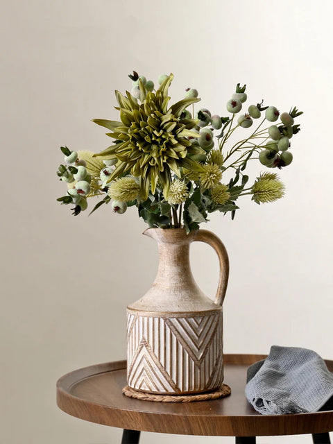 Vase on table with flowers