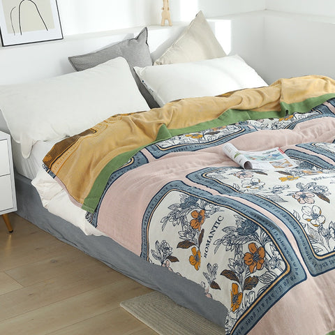 Patterned throw on bed.