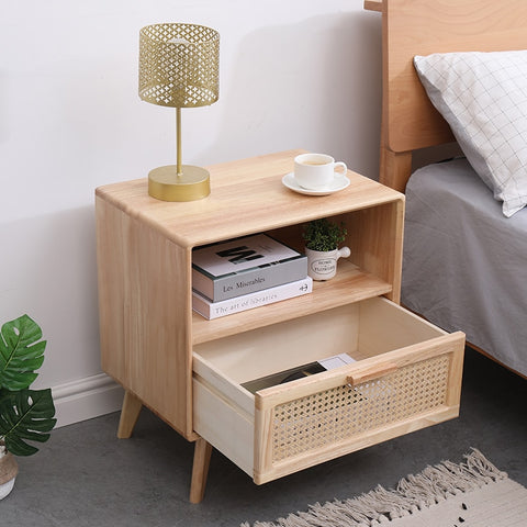 Wood and rattan bedside table with drawer open.