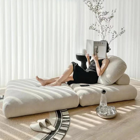 Woman lying on sofa bed