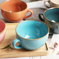 Colourful mugs on tray