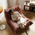 Leather-look slouch couch chair.