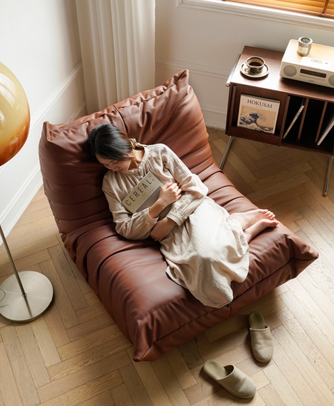 Leather-look slouch couch chair.