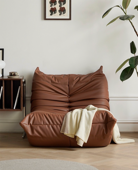 Leather-look slouch couch chair.