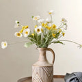 Vase on table with flowers