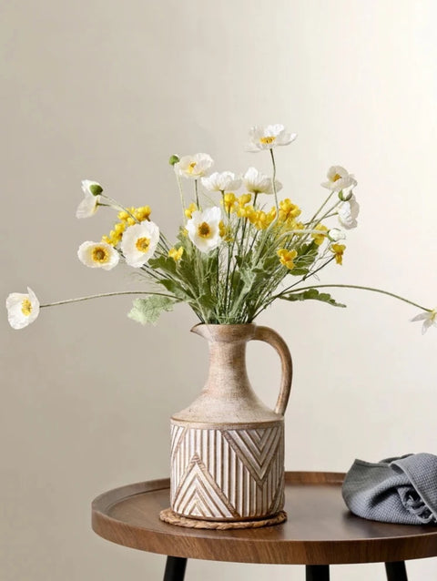 Vase on table with flowers