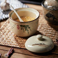 Sugar dish on table with spoon and lid