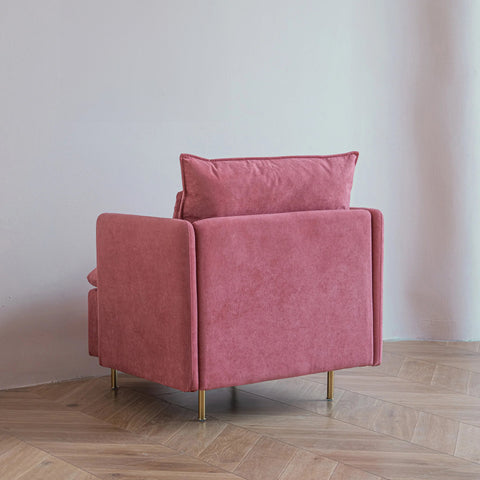 Pink armchair from behind in living room