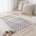 Geometric woven rug with tassels