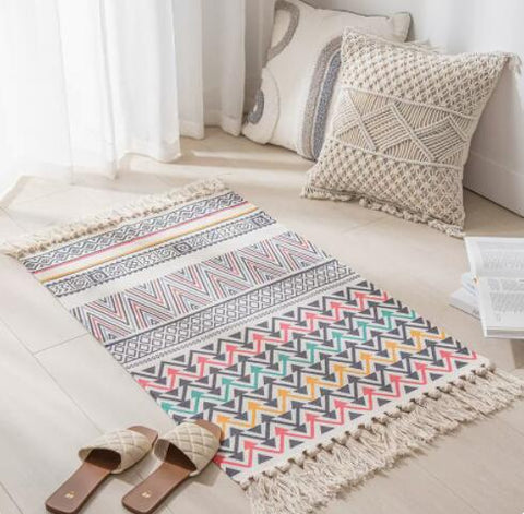 Geometric woven rug with tassels