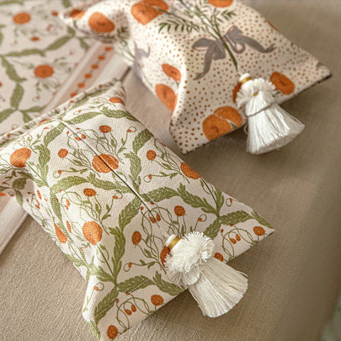 Two woven tissue boxes on table