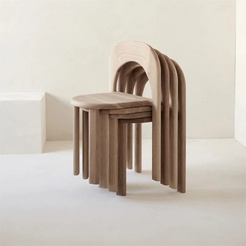 Four stacked tan ines chair