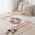 Geometric woven rug with tassels