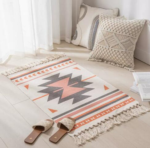 Geometric woven rug with tassels