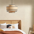 Pendant lamp above bed.