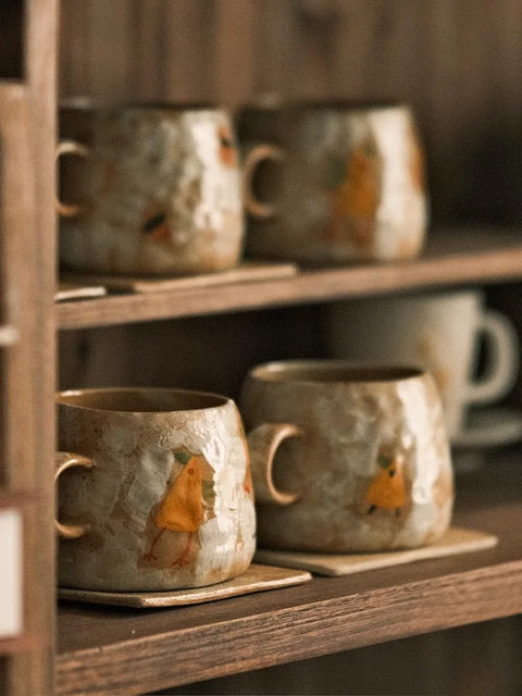 Mugs and coasters on shelf