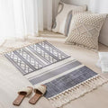 Geometric woven rug with tassels