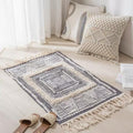 Geometric woven rug with tassels