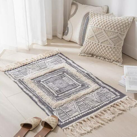 Geometric woven rug with tassels