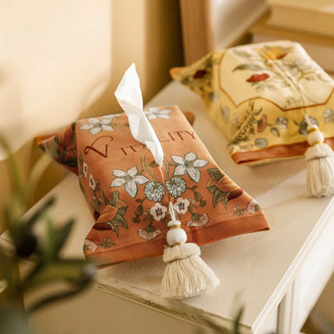 Two woven tissue boxes on table