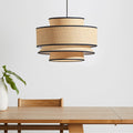 Pendant lamp above table.