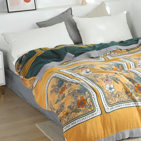 Patterned throw on bed.