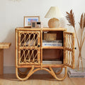 A wicker storage cupboard with one door open